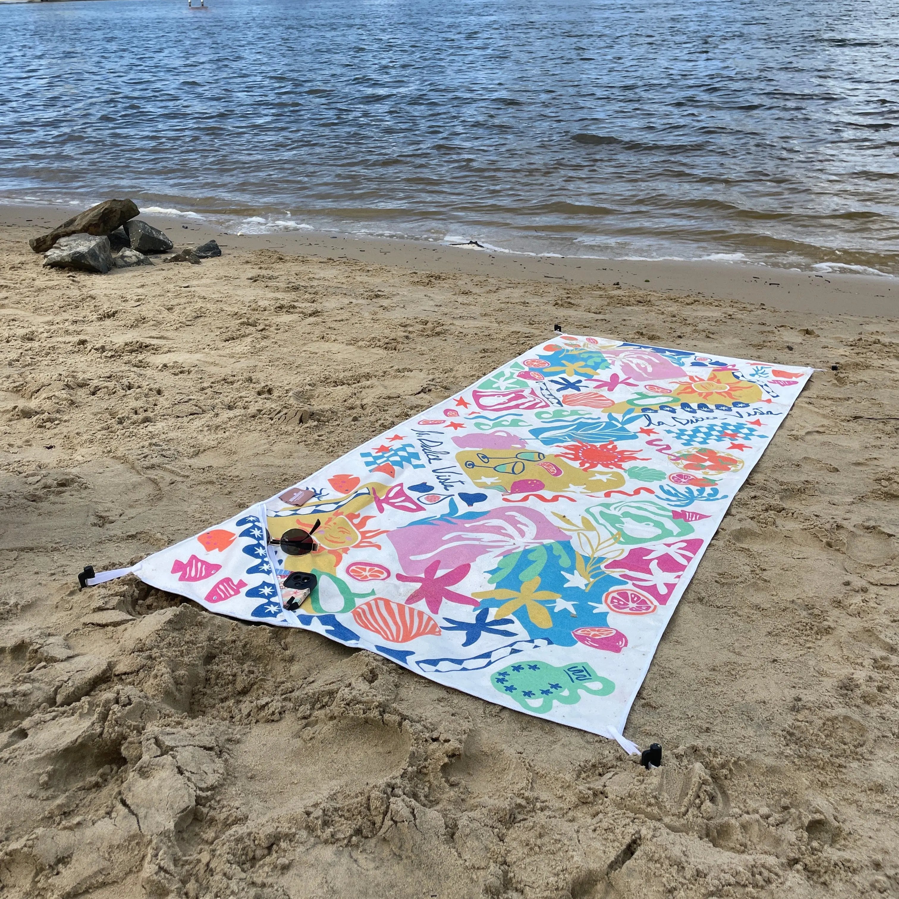 Amalfi coast sand free travel beach towel with pocket on beach