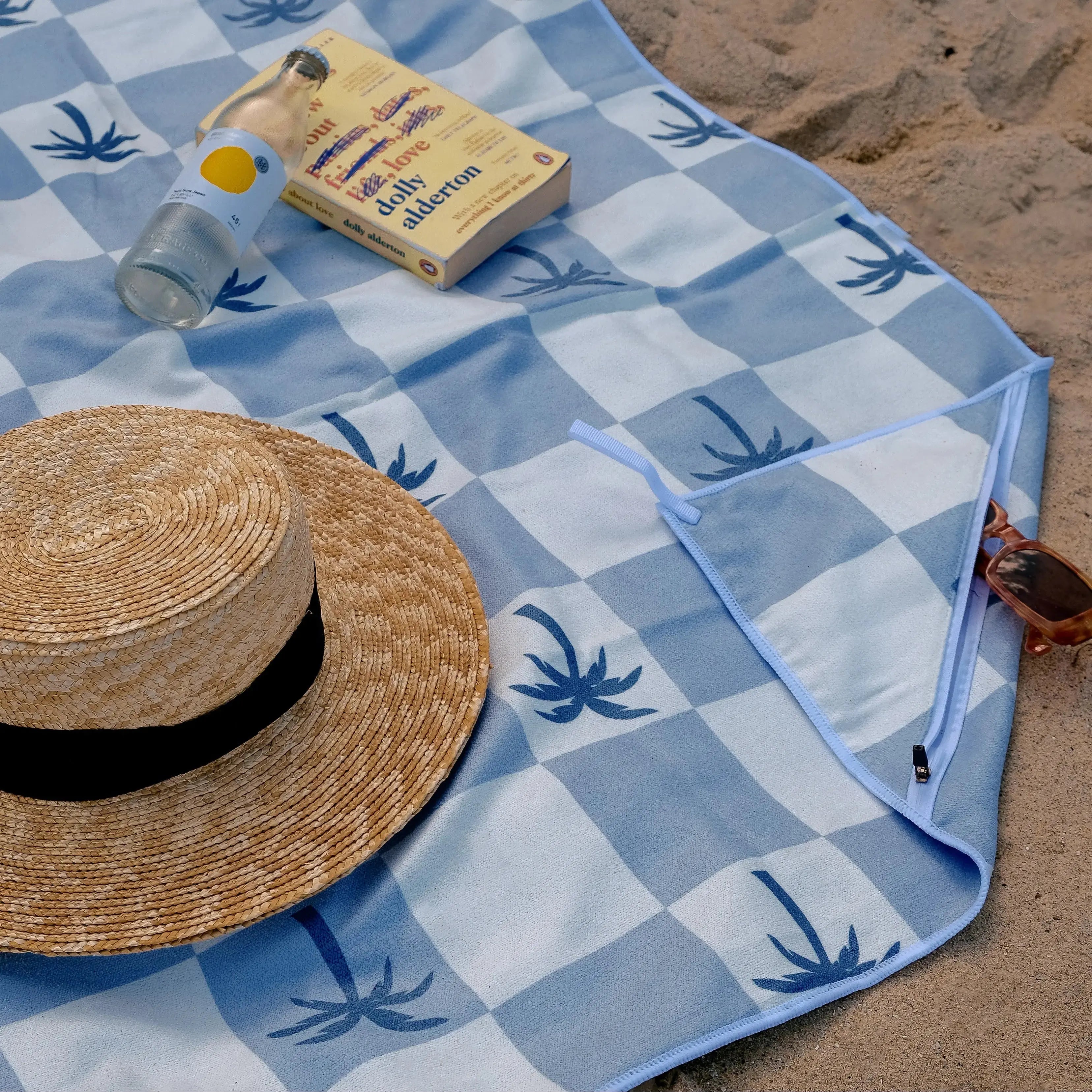 Malibu_Blue_Checkered_sand_free_Beach_Towel_With_Pocket_on_white_sand_beach_in_Australia_2