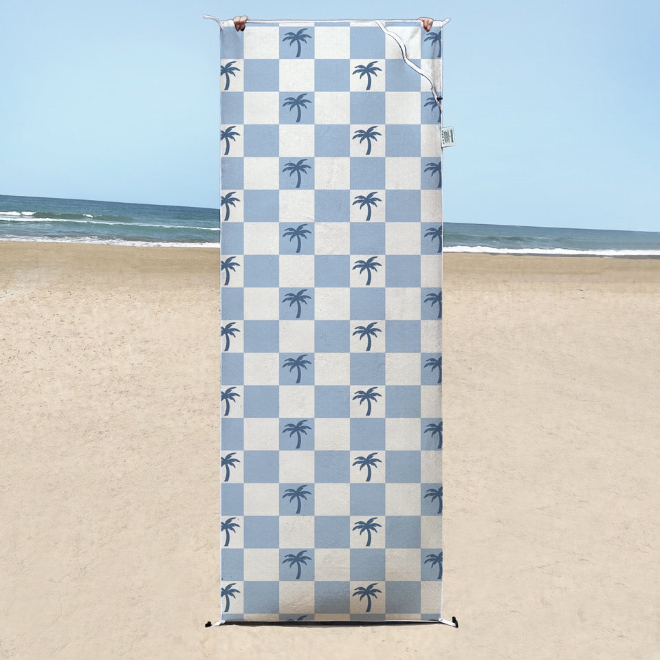 Malibu Blue Checkered sand free  Beach Towel With Pocket on white sand beach in Australia