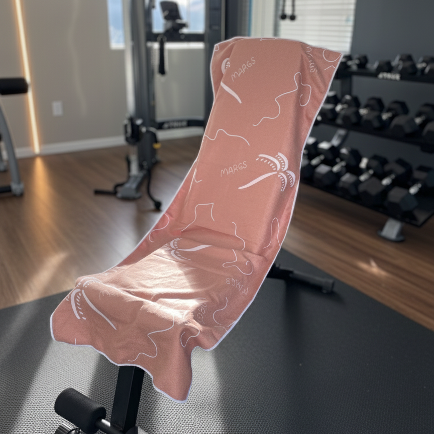 The warm brown fabric appears soft and plush, while the white graphic elements add visual movement and interest in the gym setting.