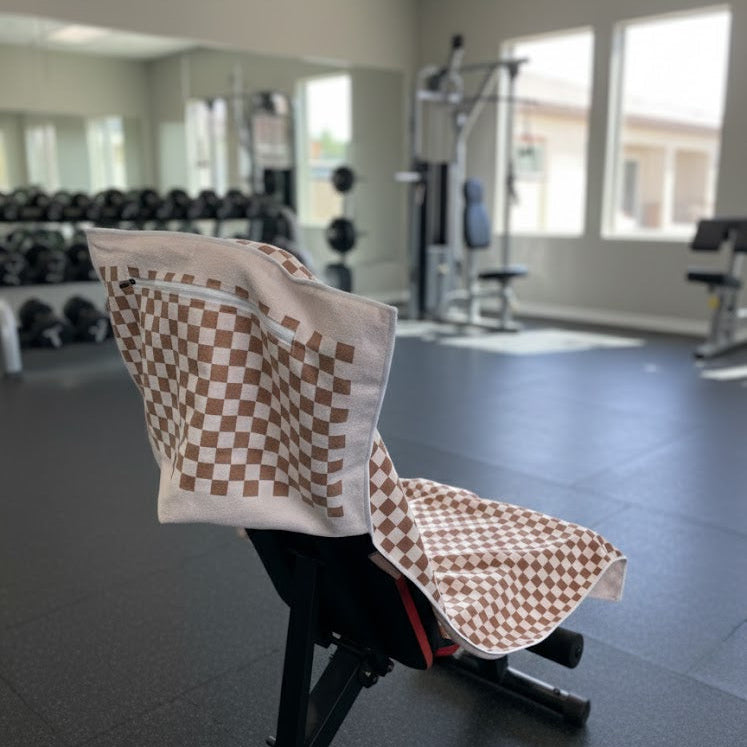 An earthy checkered brown tones softened by white accents, the design feels natural and calming, ideal for wellness spaces, gyms, and spa environments.