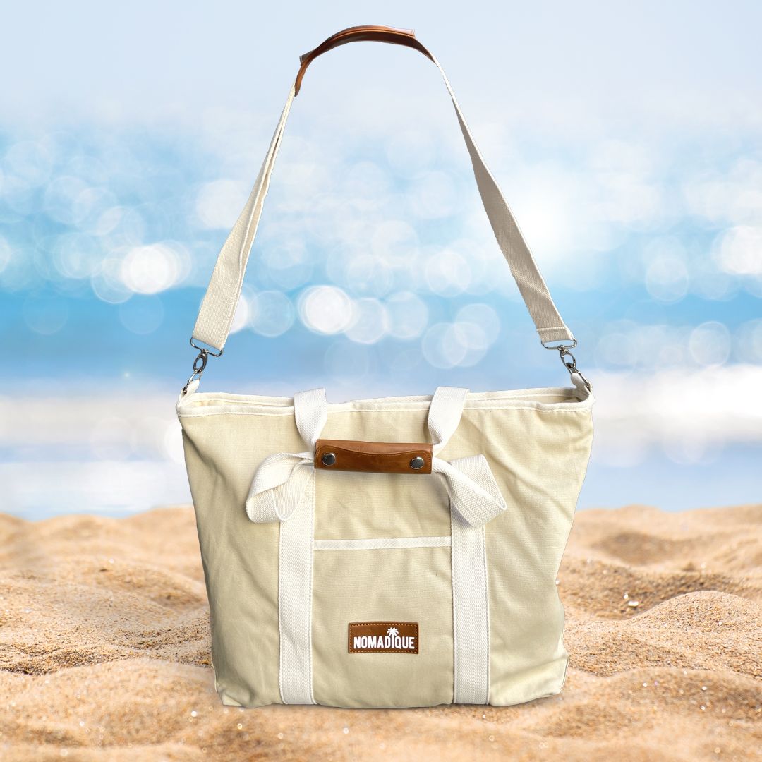 large cooler beach tote bag in beige with a zip pocket, water bottle holder on the beach. keeps food and drinks cool